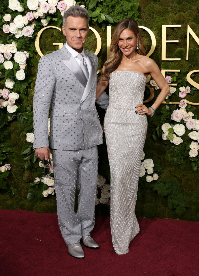  Slavní na červeném koberci 82. ročníku Zlatých glóbů: Robbie Williams a Ayda Field