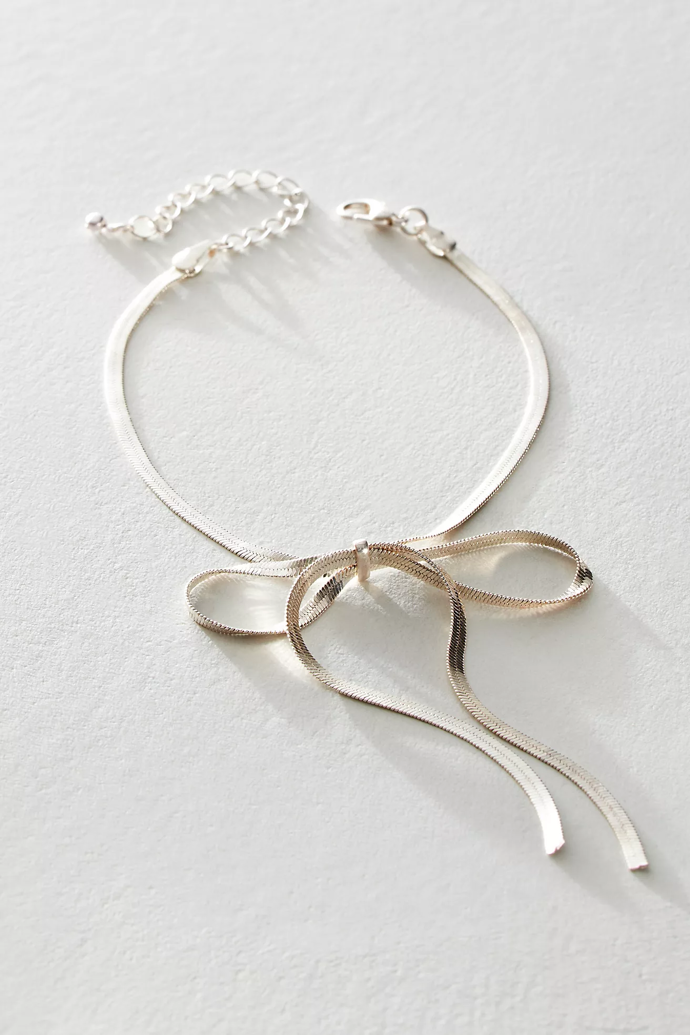 Ocelový anklet ve tvaru mašle, Free People, 25 Eur  