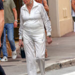 Pokud vyrazila v teplákovce, nikdy nechyběl ikonický účes a drahé šperky. 