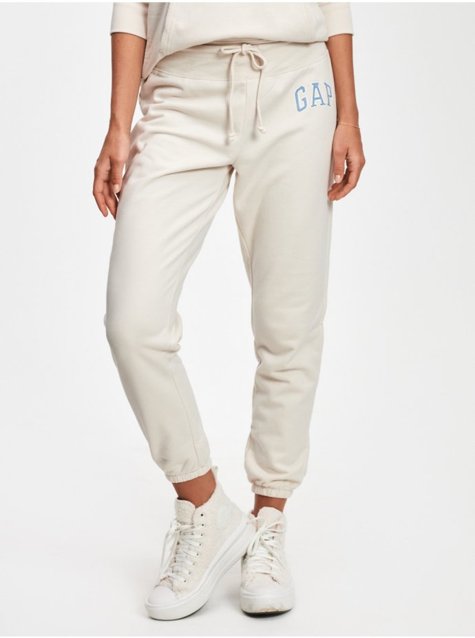 Krémové dámské tepláky s logem. GAP, 815 Kč