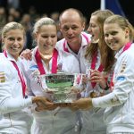 Zleva: Andrea Sestini Hlaváčková, Lucie Hradecká, Petra Kvitová a Lucie Šafářová po vítězství ve Fed Cupu. 