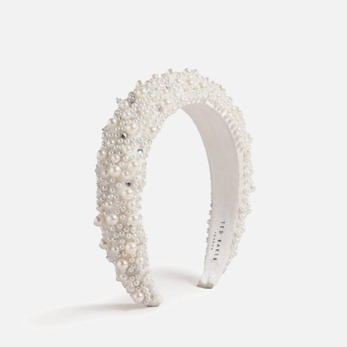 Širokou látkovou čelenku Ted Baker zdobí různě velké umělé perličky a štras. 1 100 Kč