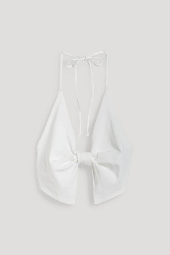 Extravagantní top s mašlí. (C&A, 298 Kč)