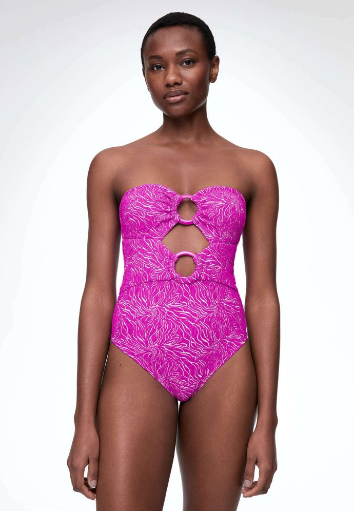 K retro prvkům řadíme i detaily s kruhovými sponami a průstřihy. (Oysho, 1 299 Kč)