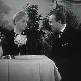 Ella Nollová a Karel Höger. Čtrnáctý u stolu (1943)