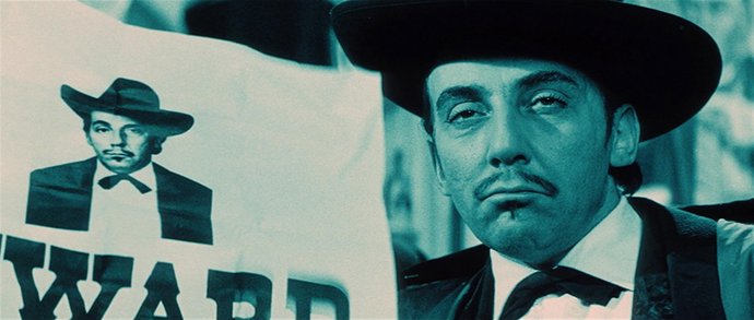 Miloš Kopecký jako gangster Hogo Fogo ve fillmu Linonádový Joe režiséra Oldřicha Lipského z roku 1964.
