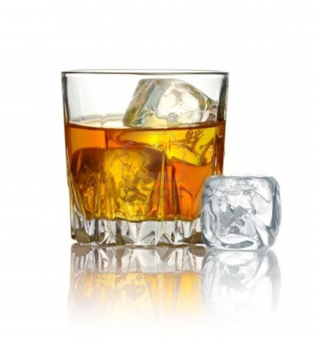 13409907-glass-of-whiskey-and-ice-isolated-on-white-background