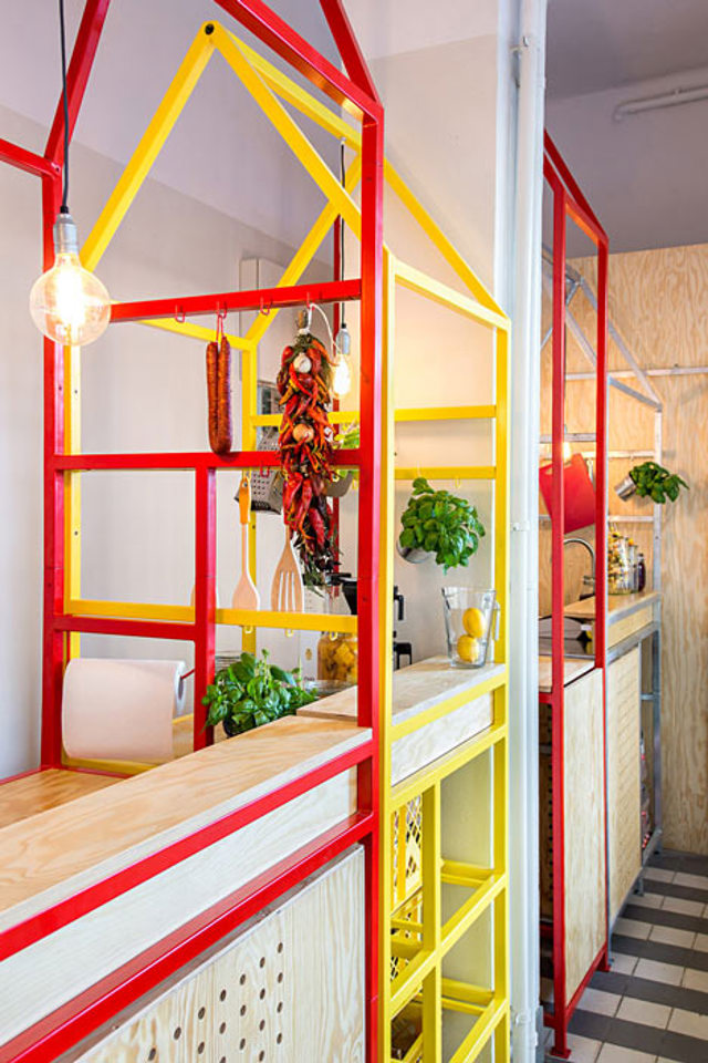Zapiekanka-restaurant-in-Warsaw-with-painted-steel-frames-by-MFRMGR_dezeen_3