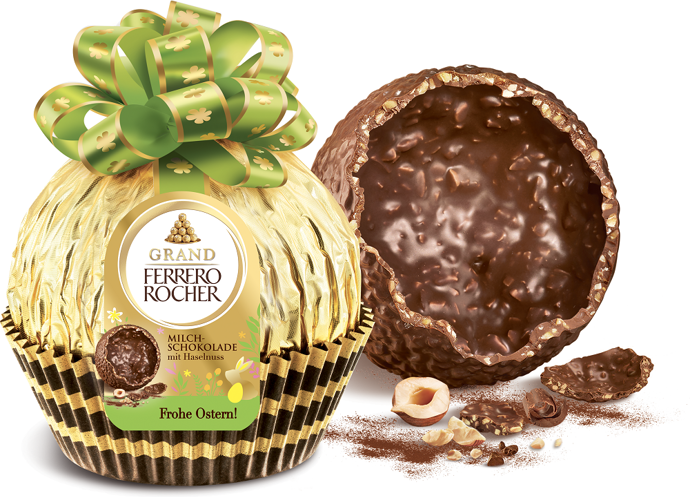 Dutá čokoládová koule Grand Ferrero Rocher s kousky drcených lískových oříšků. 
