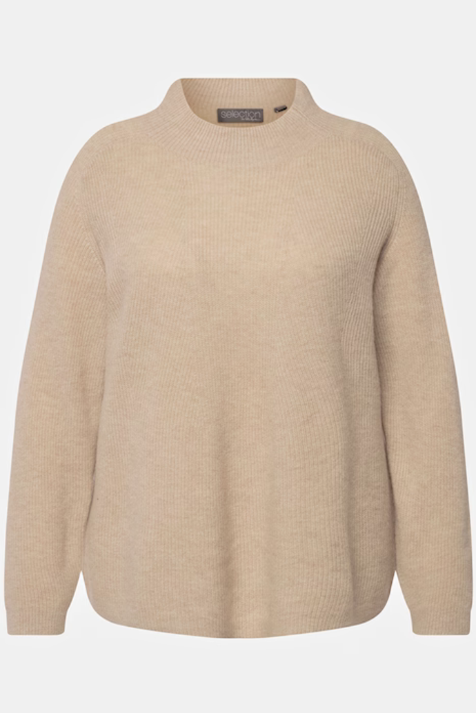 Oversized svetry často přidají vaší postavě pár kilo navíc
Oversized svetry často přidají vaší postavě pár kilo navíc