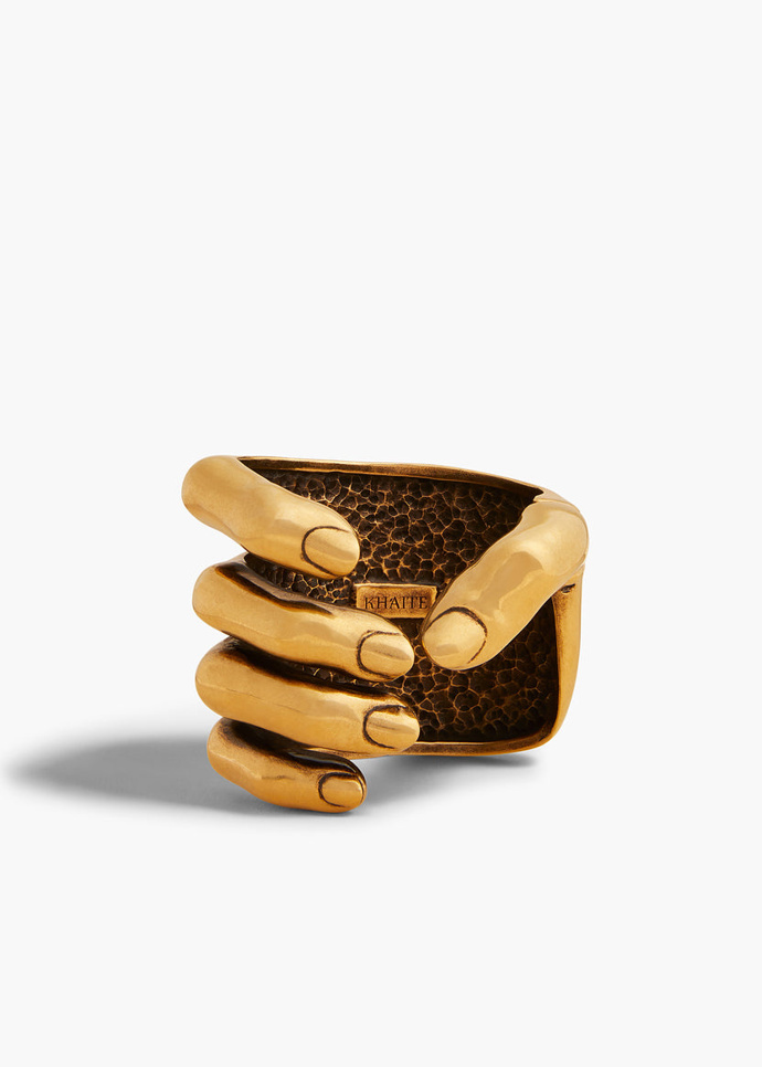 Náramek ve tvaru ruky Sculpted Hand Cuff, Khaite, 70500 Kč
Náramek ve tvaru ruky Sculpted Hand Cuff, Khaite, 70500 Kč