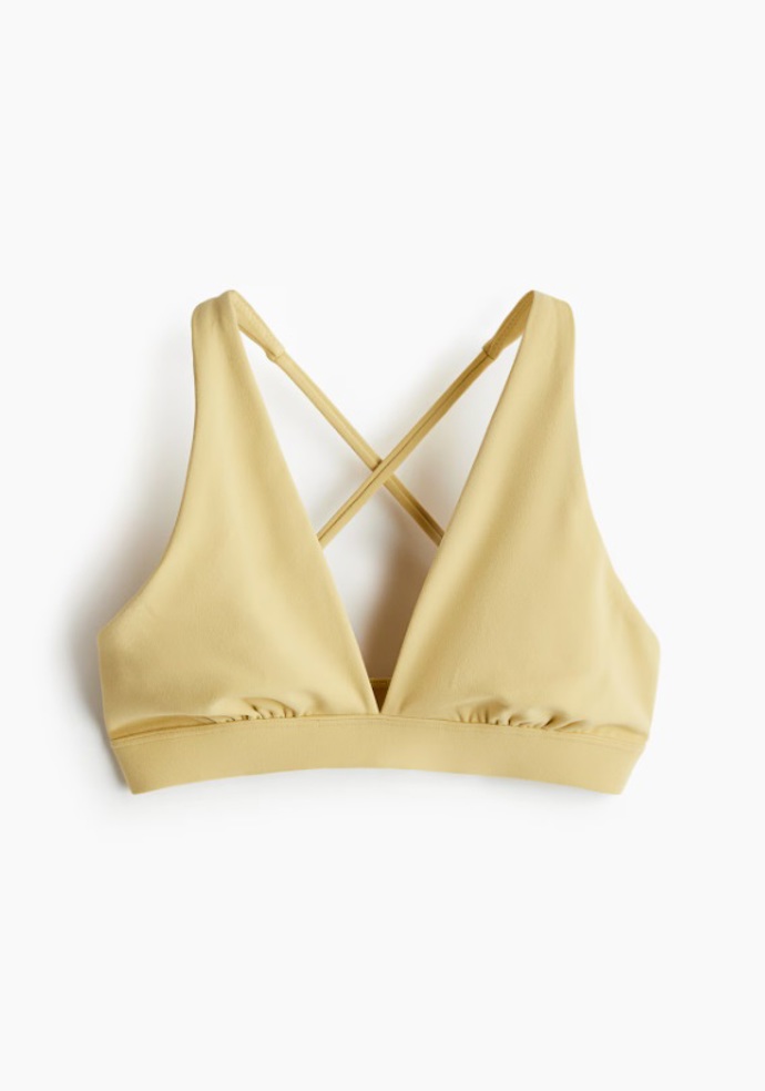 Žlutá sportovní podprsenka Light Support ze SoftMove™, H&M, 479 Kč
