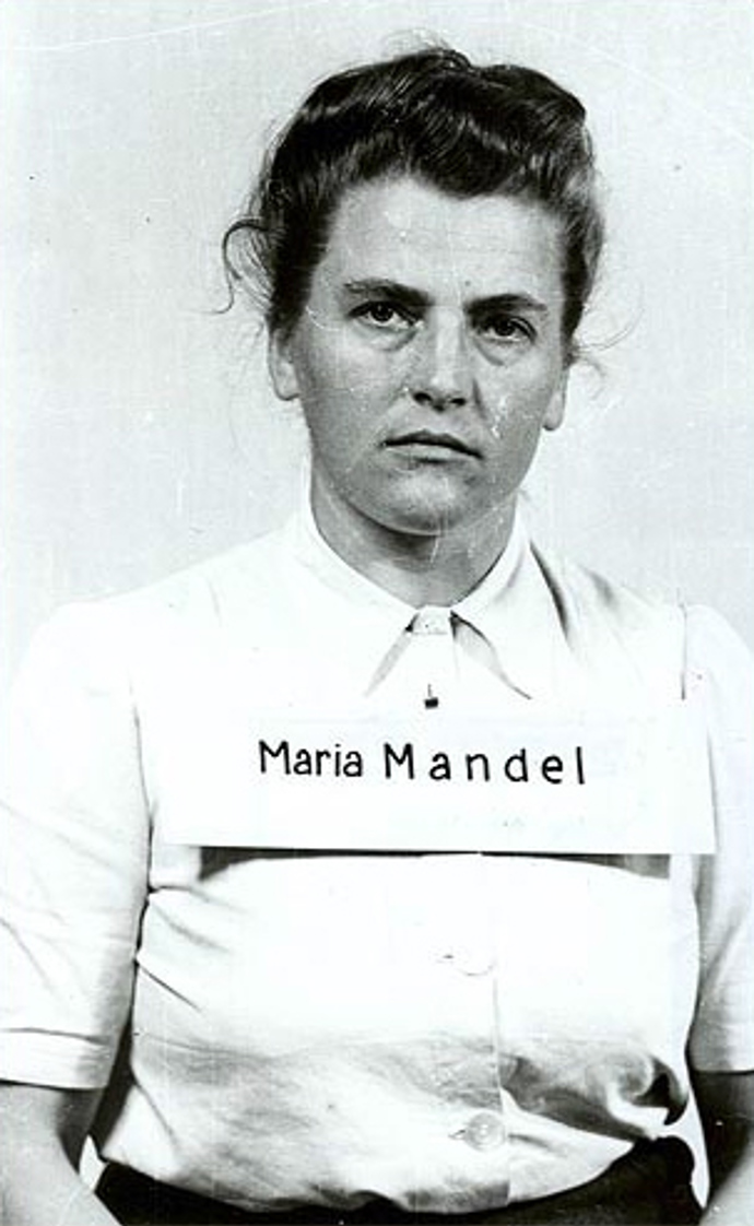 Když byla Elsa Ehrich v květnu 1945 převezena do tábora pro válečné zločince v Dachau, celu sdílela s Marií Mandel. Nejkrutější nacistické dozorkyně v Osvětimi i Ravensbrücku byla označovaná jako „Bestie“ a na smrt poslala přes půl milionu žen a dětí.
Když byla Elsa Ehrich v květnu 1945 převezena do tábora pro válečné zločince v Dachau, celu sdílela s Marií Mandel. Nejkrutější nacistické dozorkyně v Osvětimi i Ravensbrücku byla označovaná jako „Bestie“ a na smrt poslala přes půl milionu žen a dětí.