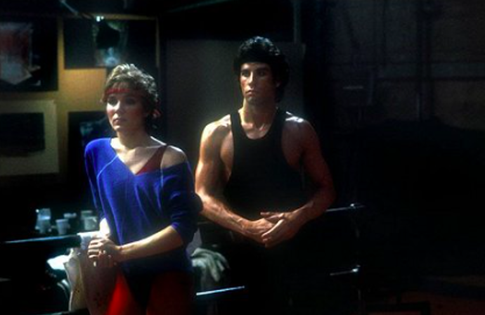 Cynthia Rhodes ve filmu Zůstat naživu. Jedná se o jeden z jejích nejdůležitějších filmů. Režíroval jej Sylvester Stallone (1983) a Cynthia zde byla partnerkou a tančila po boku Johna Travolty.
Cynthia Rhodes ve filmu Zůstat naživu. Jedná se o jeden z jejích nejdůležitějších filmů. Režíroval jej Sylvester Stallone (1983) a Cynthia zde byla partnerkou a tančila po boku Johna Travolty.