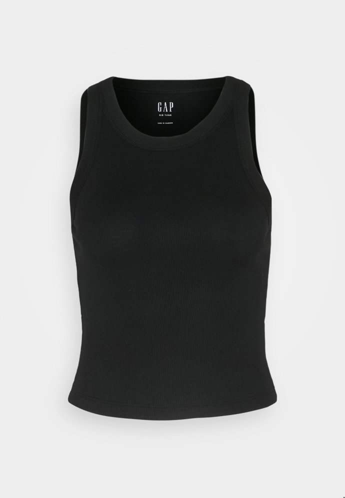 Chybět nesmí ani jednoduché tílko s vykrojenými průramky, GAP, 519 Kč.