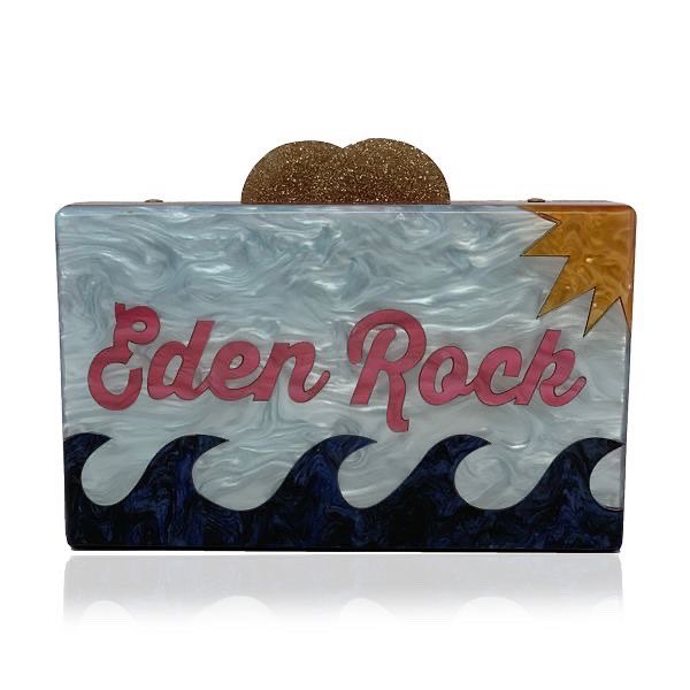 Perleťové psaníčko zdobené motivem vln, písku a slunce a nápisem Eden Rock. Elizabeth Sutton, 400 liber (cca 11 000 Kč)
