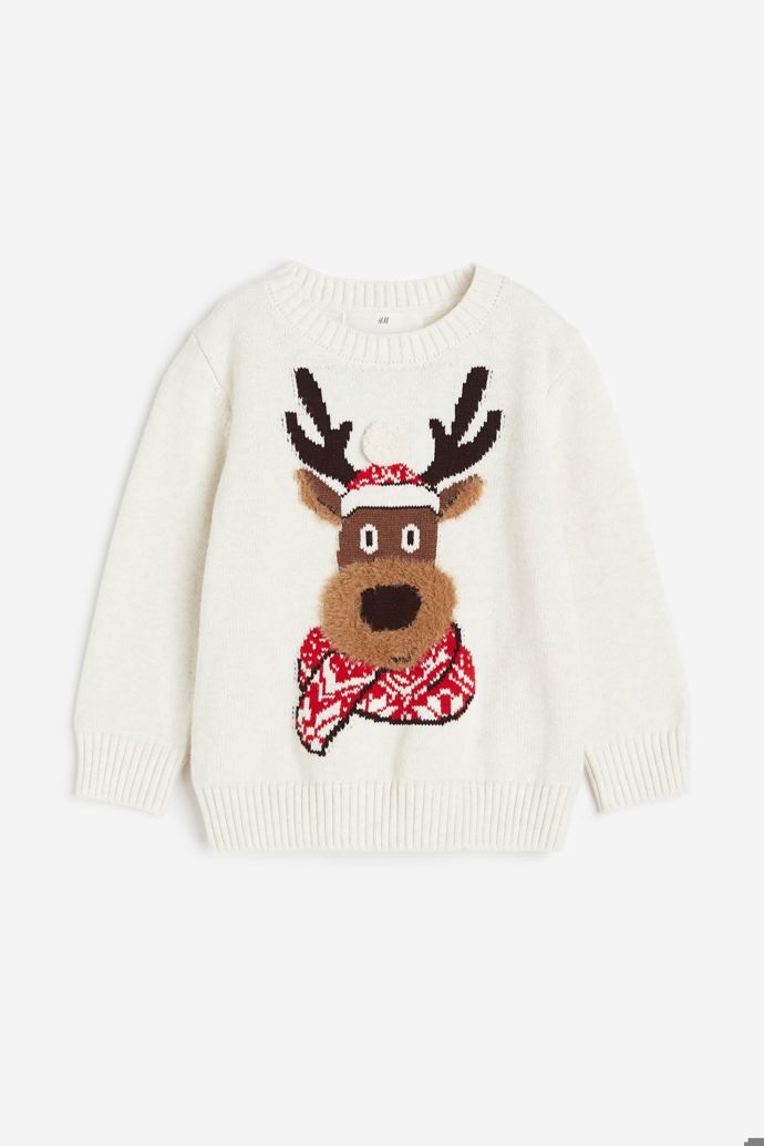 Dětem je určen i světlý pulovr se sobem, H&M za 499 Kč.