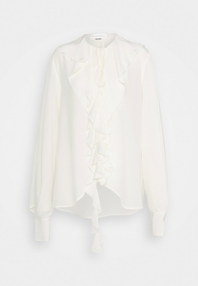 Blůza s asymetrickými volány, Victoria Beckham,  12 490 Kč.