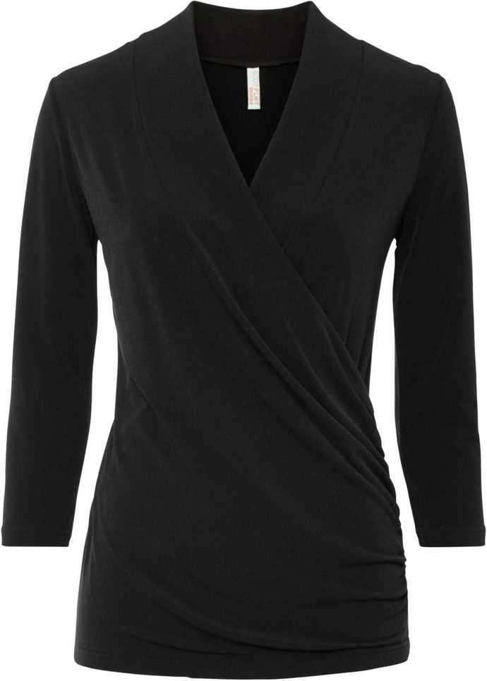 Blůza s rozhalenkou a průsvitnými rukávy sukni adekvátně vyváží. (Anna Field, 900 Kč)