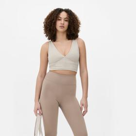 Zvonové nohavice a crop top. Ideální varianta pro postavu typu obdélníku či napodobující tvar písmene H. Díky "přestřižení" v pase si jednoduše vykouzlíte užší pas a přiblížíte siluetu ideálu přesýpacích hodin. Legíny do zvonu, Primark, 365 Kč