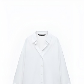 Bílá košile je základem šatníku i outfitu Anne Hathaway. Tento bílý kousek z popelínu prodává Zara za 549 Kč.