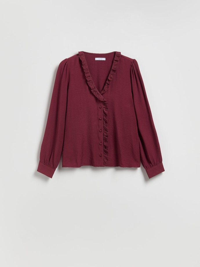 Halenku v podobně trendy odstínu jako oblékla Jana Paulová je k mání i u značky Reserved. Tento kousek s volánkovým zdobením u výstřihu vás vyjde na 499 Kč