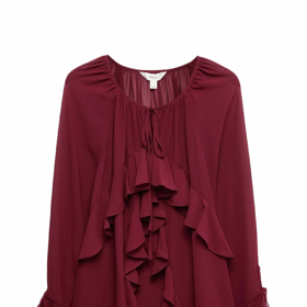 Svůj look tón v tónu ozvláštníte podobně jako Dana Morávková volánovou blůzou. Tuto halenku má v nabídce značka Marks&Spencer za 982 Kč.