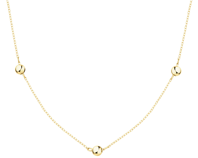 Zlatý náhrdelník tmavé základ rozzáří. Tento kousek od Apart stojí 5990 Kč.