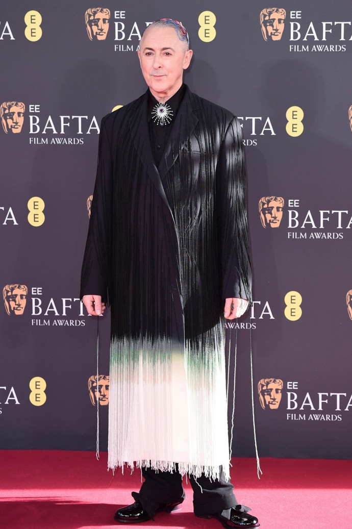 Moderátor Alan Cumming na cenách BAFTA.