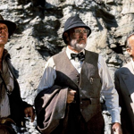 Většinu dialogů napsal scénárista českého původu Tom Stoppard.  Na snímku Harrison Ford, Sean Connery a Denholm Elliott.