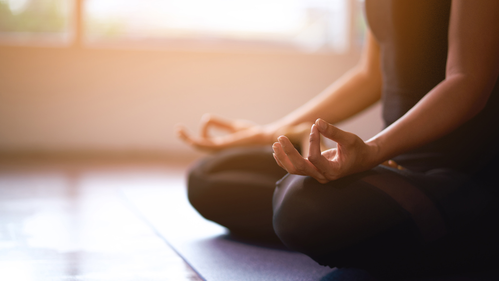 Women in meditation while practicing yoga Women in meditation while practicing yoga