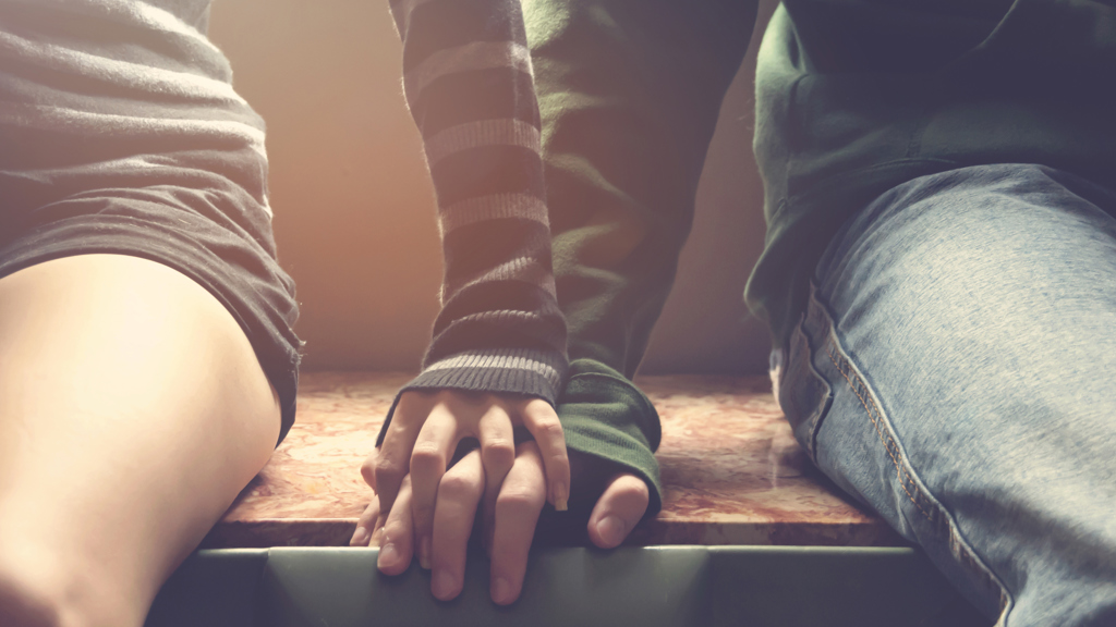 Young couple holding hands Young couple holding hands