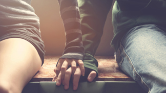 Young couple holding hands