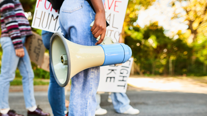 young woman with a megaphone young woman with a megaphone