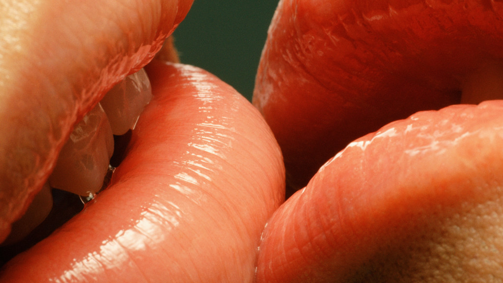 Couple with glossy lips kissing Couple with glossy lips kissing