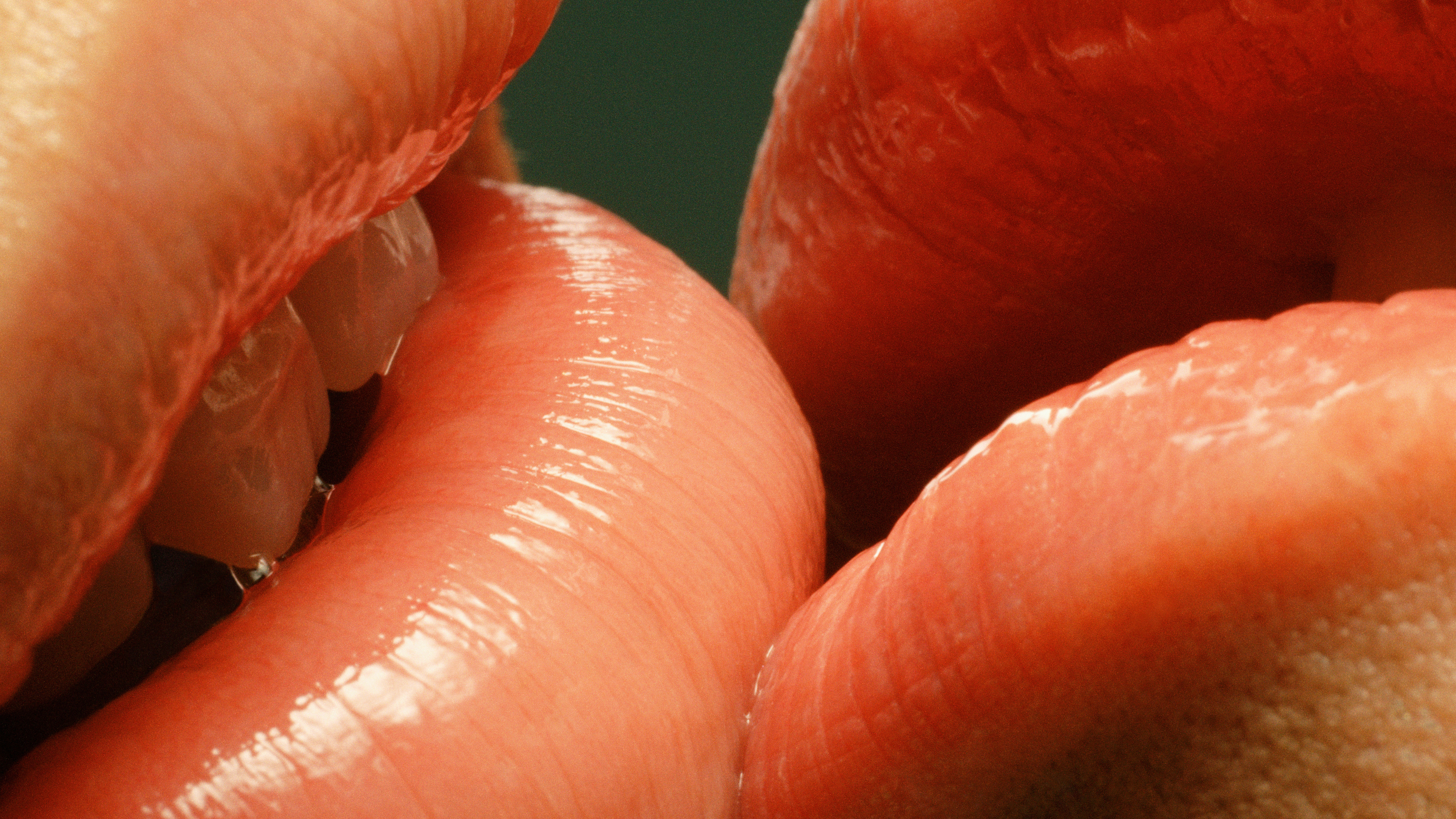 Couple with glossy lips kissing