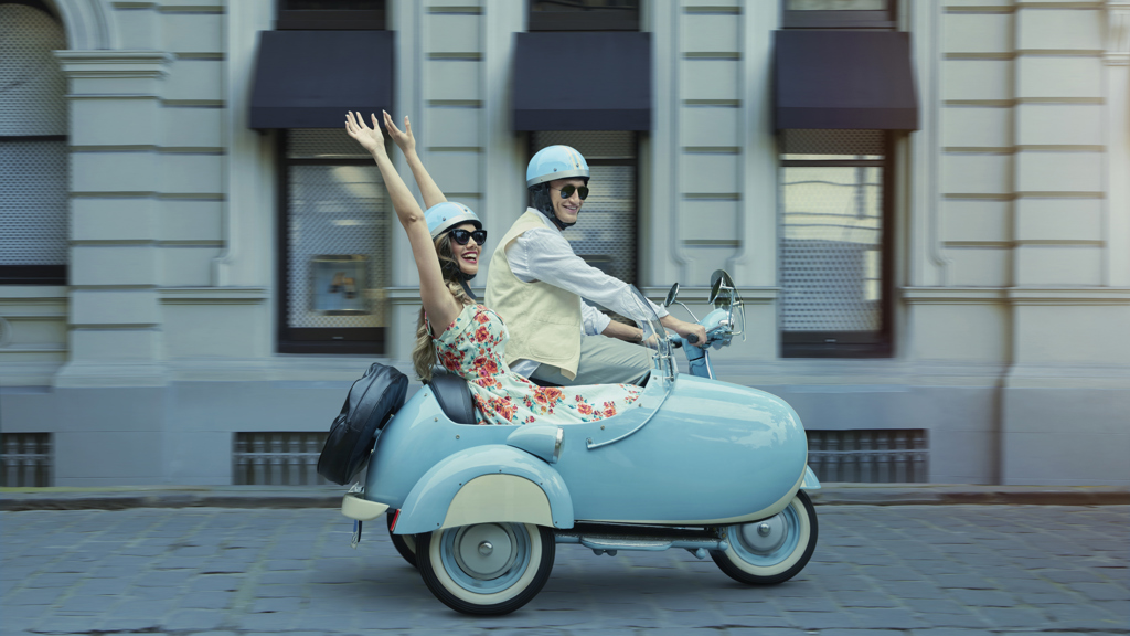 Couple driving scooter Couple driving scooter