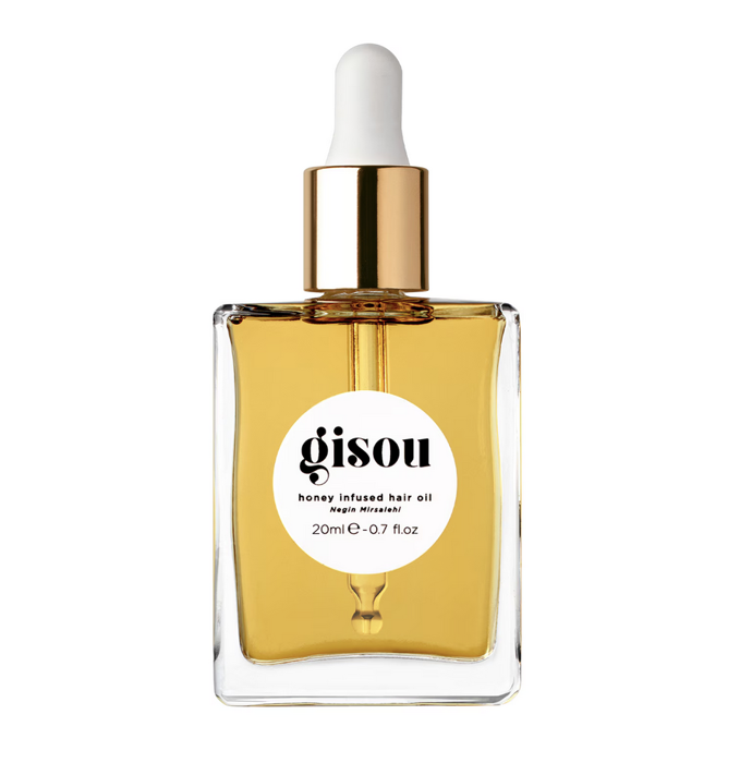 Vlasový olej  Honey Infused Hair Oil od Gisou pro hydrataci, lesk, tepelnou ochranu a kontrolu krepatění. 620 Kč